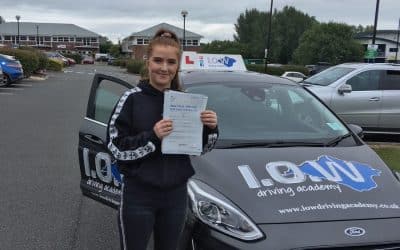 Ella passes with 5 driving faults.